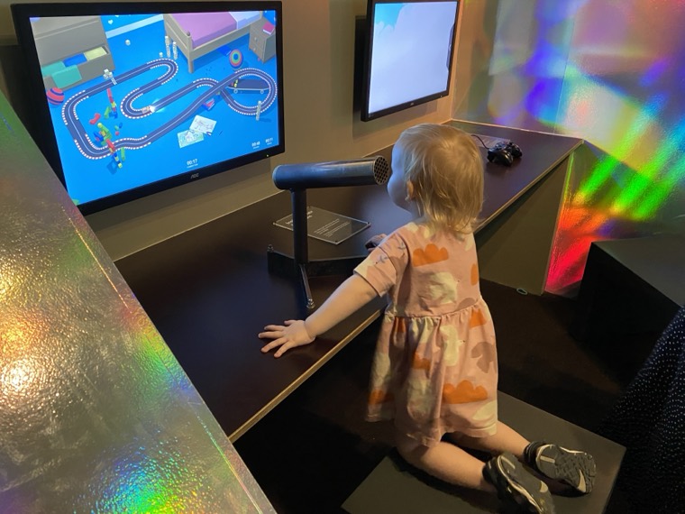 My daughter playing Car Noise, a voice-controlled racing game, at Tekniska Museet in Stockholm.